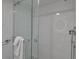 Modern bathroom featuring glass-enclosed shower and white subway tile surround at 1150 Tarpon Center Dr # 1-C 103, Venice, FL 34285