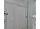 Modern tiled shower features glass door, white subway tile, and dual shower heads at 1150 Tarpon Center Dr # 1-C 103, Venice, FL 34285