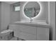 Contemporary bathroom with a lighted mirror, sleek vanity and low flow toilet at 1150 Tarpon Center Dr # 1-C 103, Venice, FL 34285