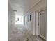Exterior hallway featuring tiled flooring and access to unit #103 at 1150 Tarpon Center Dr # 1-C 103, Venice, FL 34285