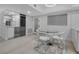 Modern, open-concept living space combining a dining area with an additional bar and a wine refrigerator at 1150 Tarpon Center Dr # 1-C 103, Venice, FL 34285