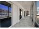 Enclosed patio with tile flooring, ceiling fans and views of the beautiful landscaping at 1150 Tarpon Center Dr # 1-C 103, Venice, FL 34285