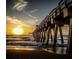 Picturesque pier stretching into the ocean at sunset, ideal for scenic walks and fishing at 1150 Tarpon Center Dr # 1-C 103, Venice, FL 34285