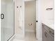 Modern bathroom featuring a glass-enclosed shower, gray vanity, and contemporary fixtures for a clean look at 12017 Cranston Way, Bradenton, FL 34211
