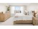 Bright bedroom with a large window, neutral decor, and a comfortable bed with plush pillows at 12017 Cranston Way, Bradenton, FL 34211