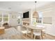 Open dining area featuring a round table, modern light fixture, and access to outdoor views at 12017 Cranston Way, Bradenton, FL 34211