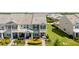 Well-manicured front lawn of gray two-story townhome with brick paver pathway at 12017 Cranston Way, Bradenton, FL 34211