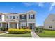 Inviting front exterior of gray two-story townhome with manicured landscaping at 12017 Cranston Way, Bradenton, FL 34211