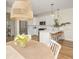 Bright kitchen with stainless steel appliances, white cabinets, and modern pendant lighting above the breakfast bar at 12017 Cranston Way, Bradenton, FL 34211