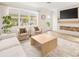 Inviting living room featuring stylish seating, natural light, and a modern entertainment setup at 12017 Cranston Way, Bradenton, FL 34211