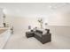 Bright living room with white trim, recessed lighting, and cozy gray pull out sofa at 12017 Cranston Way, Bradenton, FL 34211