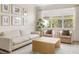 Cozy living room with comfortable seating, natural light, and stylish decor for a relaxing atmosphere at 12017 Cranston Way, Bradenton, FL 34211