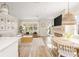 Open-concept living space with dining area and modern decor, filled with natural light at 12017 Cranston Way, Bradenton, FL 34211