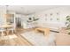 Open-concept living space featuring kitchen, dining, and living areas with natural light and modern finishes at 12017 Cranston Way, Bradenton, FL 34211