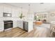 Bright, open-concept kitchen and living space with modern appliances and stylish decor at 12017 Cranston Way, Bradenton, FL 34211