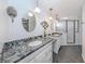 Dual vanity bath with granite countertops and walk-in shower at 154 Inlets Blvd, Nokomis, FL 34275