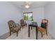 Bedroom with natural light and view of backyard at 154 Inlets Blvd, Nokomis, FL 34275