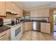 Kitchen with granite counters and stainless steel appliances at 154 Inlets Blvd, Nokomis, FL 34275
