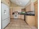 Kitchen with granite counters, stainless appliances, and tile flooring at 154 Inlets Blvd, Nokomis, FL 34275