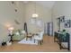 Bright living room with vaulted ceilings, fan, adjacent dining room, and bamboo flooring at 154 Inlets Blvd, Nokomis, FL 34275