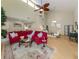 Open-concept living room with bamboo flooring, high ceilings, fan, and lots of natural light at 154 Inlets Blvd, Nokomis, FL 34275
