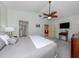 Bedroom with ceiling fan, ensuite and view of living room at 154 Inlets Blvd, Nokomis, FL 34275