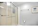 Bathroom with shower stall with glass door and modern fixtures, creating a clean and functional space at 170 Edgewood Dr, Osprey, FL 34229