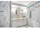 Bright bathroom featuring a yellow sink, white cabinetry, decorative wall art, and a shower with a patterned curtain at 170 Edgewood Dr, Osprey, FL 34229