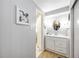 Well-lit bathroom features a clean vanity and ample storage space, creating a functional and inviting area at 170 Edgewood Dr, Osprey, FL 34229