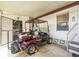 Carport area featuring a golf cart and utility area, perfect for storage and outdoor activities at 170 Edgewood Dr, Osprey, FL 34229