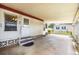 Open carport providing ample space for parking with direct access to the home's entrance at 170 Edgewood Dr, Osprey, FL 34229