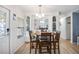 Cozy dining area featuring a table with chairs, built-in cabinetry, and view to the kitchen at 170 Edgewood Dr, Osprey, FL 34229
