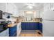 Cozy kitchen featuring white appliances, bright cabinetry, wood countertop, and a sink beneath a sunlit window at 170 Edgewood Dr, Osprey, FL 34229