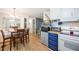 Eat-in kitchen with bright cabinetry and wood countertop with a dining area, creating a cozy and functional space at 170 Edgewood Dr, Osprey, FL 34229