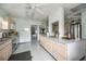 Spacious kitchen featuring stainless steel appliances and an oversized island counter at 170 Edgewood Dr, Osprey, FL 34229