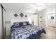 Spacious main bedroom features a comfortable bed, closet space, and ensuite bathroom at 170 Edgewood Dr, Osprey, FL 34229