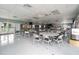 Spacious meeting room with tables and chairs, ideal for community gatherings and activities at 170 Edgewood Dr, Osprey, FL 34229