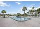 Well-maintained community swimming pool, surrounded by lush landscaping and comfortable seating at 170 Edgewood Dr, Osprey, FL 34229
