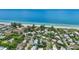 Scenic aerial view of a coastal community, showcasing the beautiful homes, beaches, and ocean waters at 202 75Th St, Holmes Beach, FL 34217