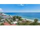 Stunning aerial view of beachfront homes, showcasing the beautiful coastline and serene ocean waters at 202 75Th St, Holmes Beach, FL 34217