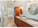 Bathroom features double sinks, granite countertop, and tiled flooring at 202 75Th St, Holmes Beach, FL 34217