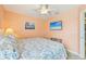 This bedroom features a flat screen television, comfortable bed, and calming hues at 202 75Th St, Holmes Beach, FL 34217