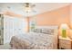 A comfortable bedroom offers closet space, a ceiling fan and a serene atmosphere at 202 75Th St, Holmes Beach, FL 34217