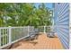 Spacious deck surrounded by palm trees offers seating for relaxation at 202 75Th St, Holmes Beach, FL 34217