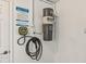 Garage with EV charger installed and central vacuum unit at 202 75Th St, Holmes Beach, FL 34217