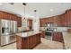 Updated kitchen boasts granite counters, a center island and stainless steel appliances at 202 75Th St, Holmes Beach, FL 34217