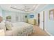 Light-filled main bedroom has an ensuite bathroom and neutral decor at 202 75Th St, Holmes Beach, FL 34217