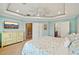 Bright main bedroom features a tray ceiling and en-suite bathroom at 202 75Th St, Holmes Beach, FL 34217
