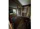 Shows an empty bedroom with dirty, aged floor and walls and a hole in the ceiling at 2026 Seminole S Blvd, St Petersburg, FL 33705