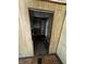 Shows a view from one bedroom into another, with water damage and aged wall paper at 2026 Seminole S Blvd, St Petersburg, FL 33705